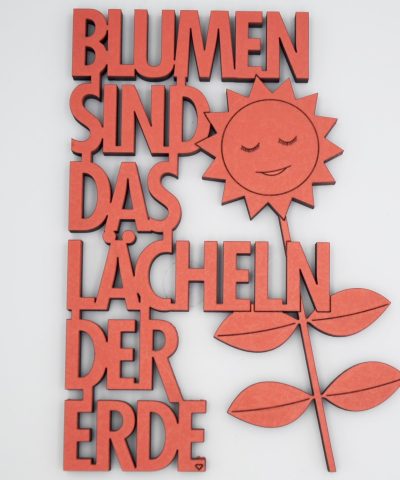 Holzschrift / Blumen sind das Lächeln...